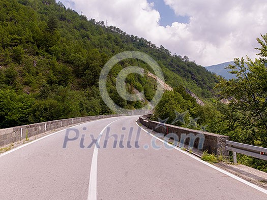 asphalt road in beautiful countryside on sunny summer day asphalt road in beautiful countryside on sunny summer day