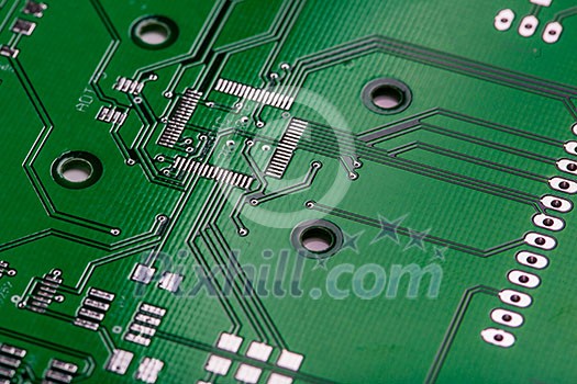 Printed green computer circuit board with many electrical components