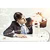 Young businessman making pyramid with empty wooden cubes