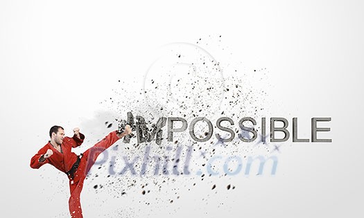 Determined karate man breaking stone impossible word Determined karate man breaking stone impossible word