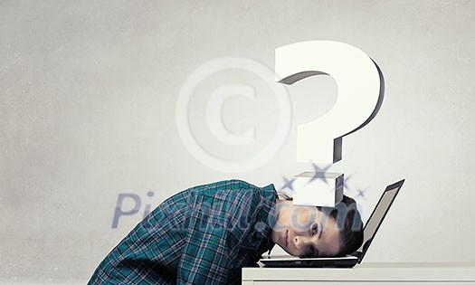 Woman programmer pressed with question mark to laptop Woman programmer pressed with question mark to laptop