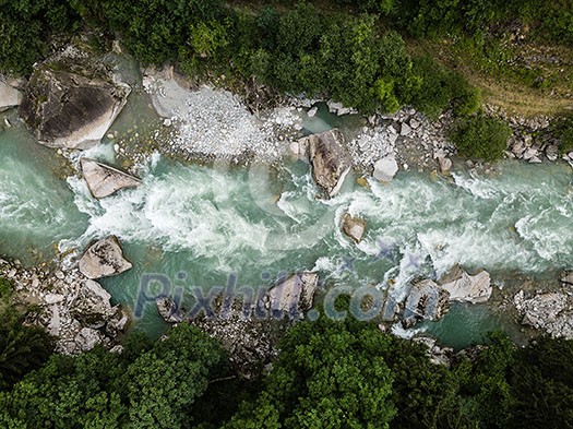 Aerial top view of a splendid whitewater on a mountain river in Swiss Alps Aerial top view of a splendid whitewater on a mountain river in Swiss Alps