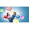 Two young woman in casual with colorful balloons celebrating