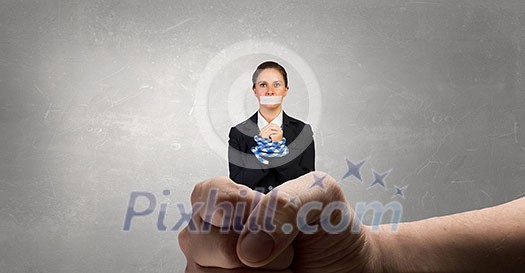 Young businesswoman with tape on mouth and tired hands Young businesswoman with tape on mouth and tired hands