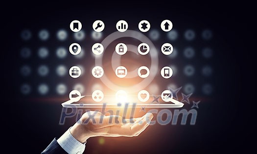 Hand of businessman holding touchpad pc presenting social network concept