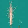 Burning firework with bright sparkes and smoke from burnt candle on a turquoise background, copy space. Concept of festive event.