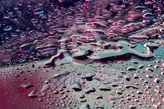 Fashionable background with UV effect lighting close-up water droplets. Trendy backdrop for your design.
