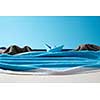 Handcraft sea waves and stone rocks made from fluffy towels and blue ship on a paper background with copy space.