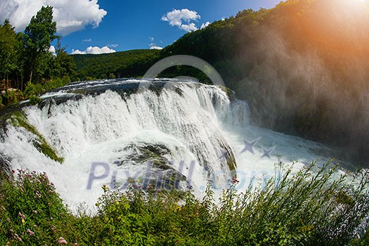 waterfall in beautiful nature with crystal clear water on wild river una in bosnia and herzegovina at sunny summer day waterfall in beautiful nature with crystal clear water on wild river una in bosnia and herzegovina at sunny summer day