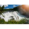 waterfall in beautiful nature with crystal clear water on wild river una in bosnia and herzegovina at sunny summer day