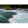 waterfall in beautiful nature with crystal clear water on wild river una in bosnia and herzegovina at sunny summer day