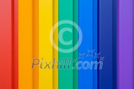 Multiples vertical color stripes on a metal wall - flawlessly painted with lovely vivid colors Multiples vertical color stripes on a metal wall - flawlessly painted with lovely vivid colors