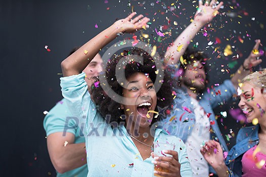 confetti party Multiethnics group of happy young people celebrating new year eve while dancing and have fun at home