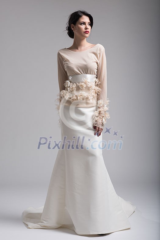 Portrait of beautiful young women in wedding dress isolated on a white background Portrait of beautiful young women in wedding dress isolated on a white background