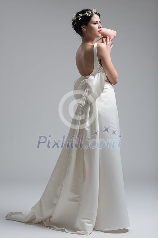 Portrait of beautiful young women in wedding dress isolated on a white background Portrait of beautiful young women in wedding dress isolated on a white background