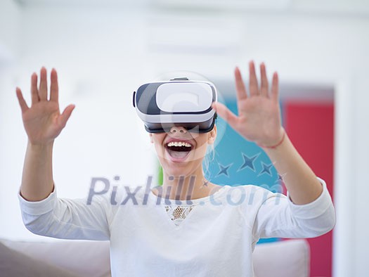 Smile happy woman getting experience using VR-headset glasses of virtual reality at home Smile happy woman getting experience using VR-headset glasses of virtual reality at home