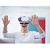 Smile happy woman getting experience using VR-headset glasses of virtual reality at home