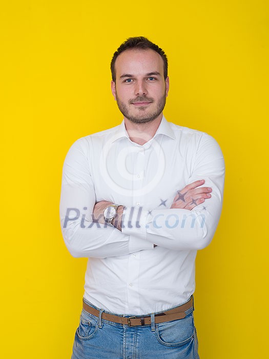portrait of a handsome young man isolated over a yellow background