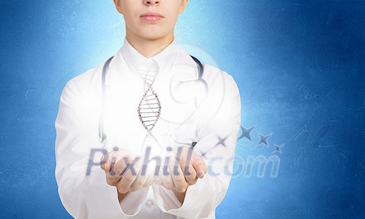 Close up of female doctor holding DNA molecule in hands