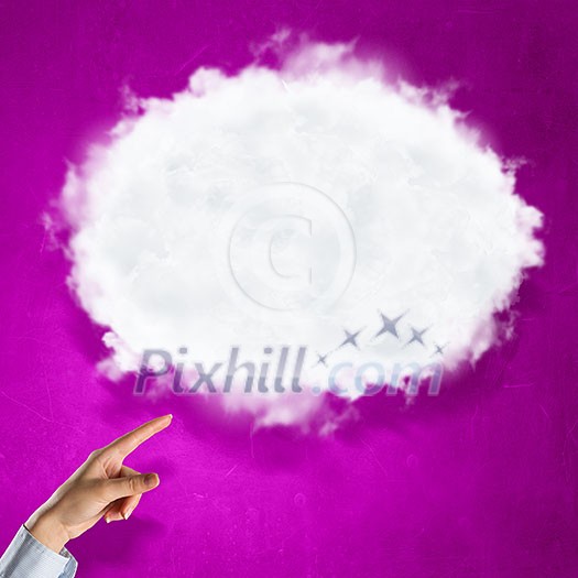 Hand pointing with finger at cloud on color background