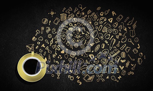 Top view of coffee cup and sketches on dark background Top view of coffee cup and sketches on dark background