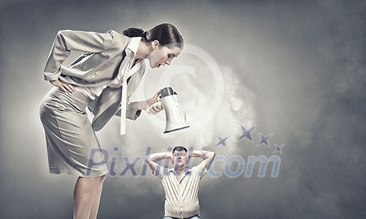 Furious woman screaming agressively in megaphone at man Furious woman screaming agressively in megaphone at man