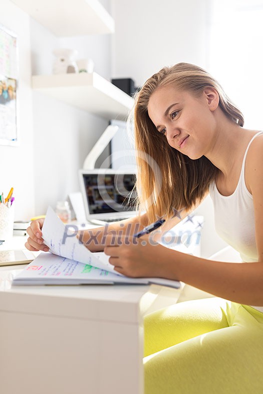 Teenage girl studing for school on a sunny Sunday morning Teenage girl studing for school on a sunny Sunday morning