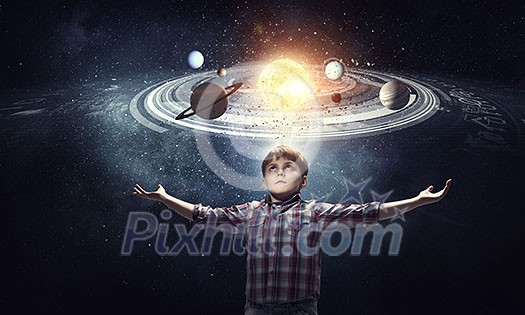 Cute boy of school age exploring space system. Mixed media Cute boy of school age exploring space system. Mixed media