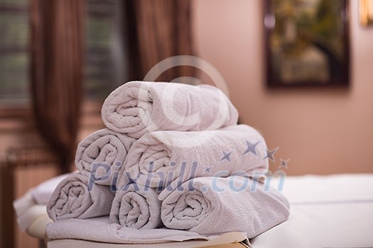rolls of white towels in spa salon rolls of white towels in spa salon