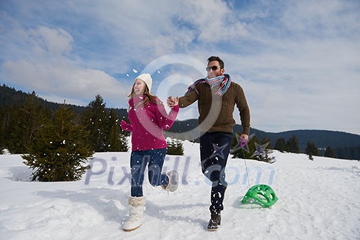 romantic winter  scene, happy young couple having fun on fresh show on winter vacatio, mountain nature landscape