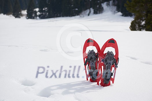 snowshoes in fresh show on beautiful winter sunny day snowshoes in fresh show on beautiful winter sunny day