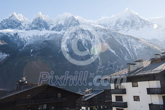 French alps mountain peaks covered with fresh snow. Winter landscape nature scene on beautiful sunny winter day.