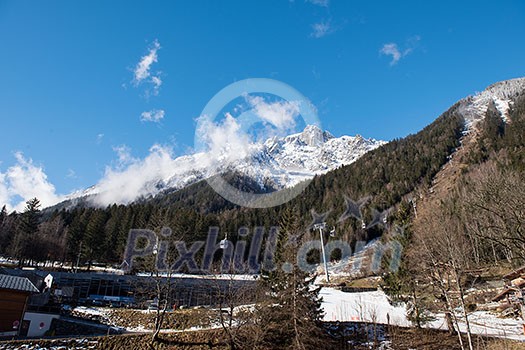 French alps mountain peaks covered with fresh snow. Winter landscape nature scene on beautiful sunny winter day.