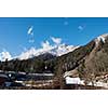 French alps mountain peaks covered with fresh snow. Winter landscape nature scene on beautiful sunny winter day.