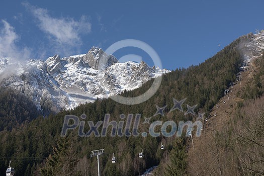 French alps mountain peaks covered with fresh snow. Winter landscape nature scene on beautiful sunny winter day.