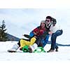 Winter playing, fun, snow and family portrait  sledding at winter time