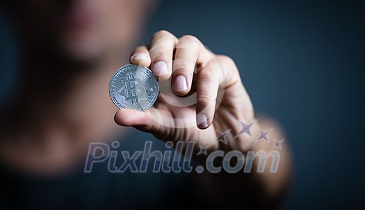 Bitcoin - Cryptocurrency concept - cryptocurrency being held as a value conserving asset as well a mean of swift exchange having a fungible, antiinflationary, decentralized nature Bitcoin - Cryptocurrency concept - cryptocurrency being held as a value conserving asset as well a mean of swift exchange having a fungible, antiinflationary, decentralized nature