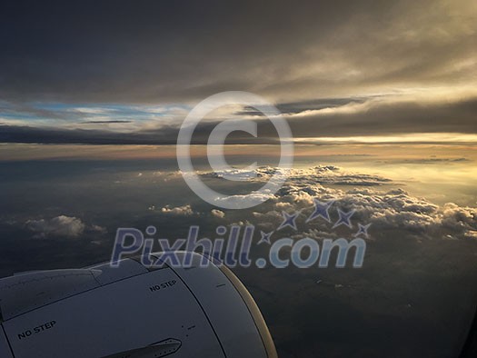 View of the sky and clouds from the airplane porthole. jet engine turbine look through aircraft window