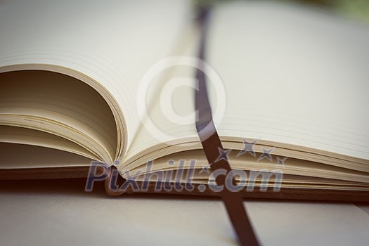 Opened book on the table. Close up.