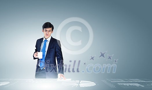 Young businessman and statistics information at background Young businessman and statistics information at background