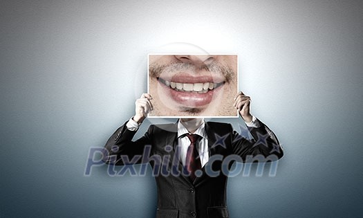 Unrecognizable businessman holding photo with smiling mouth Unrecognizable businessman holding photo with smiling mouth