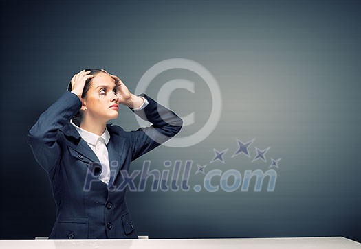 Young troubled businesswoman with hands on head Young troubled businesswoman with hands on head