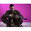 army soldier using smartphone to contact family or girlfriend communication and nostalgia concept pink background