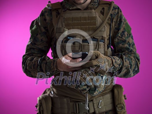 army soldier using smartphone to contact family or girlfriend communication and nostalgia concept pink background army soldier using smartphone to contact family or girlfriend communication and nostalgia concept pink background