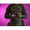 army soldier using smartphone to contact family or girlfriend communication and nostalgia concept pink background