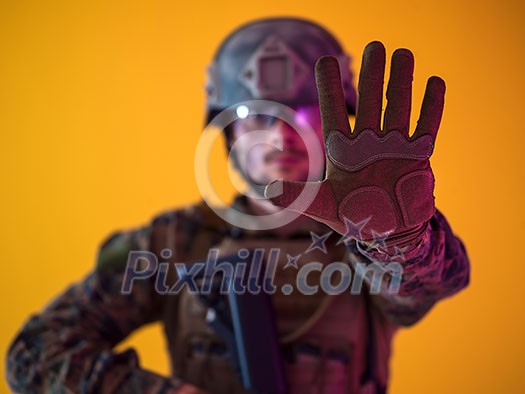 Modern warfare american marines soldier showing stop sign or no passing with open palm of hand Modern warfare american marines soldier showing stop sign or no passing with open palm of hand