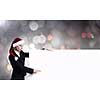 Santa woman pointing with finger at blank banner. Place for your text