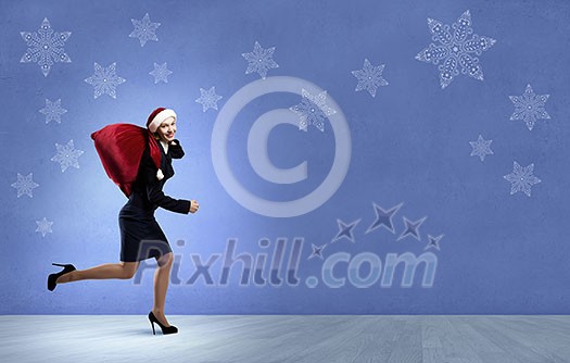 Santa woman running with red gift bag on back Santa woman running with red gift bag on back