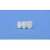 Metal free ceramic dental crowns isolated on a blue background