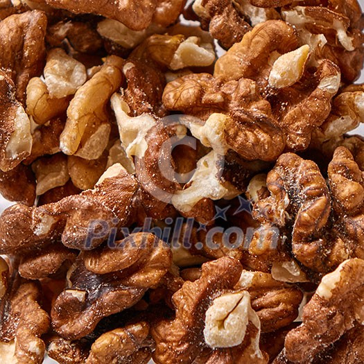 Texture of natural walnuts background. Natural organic food for diet vegetarian eating. Top view.